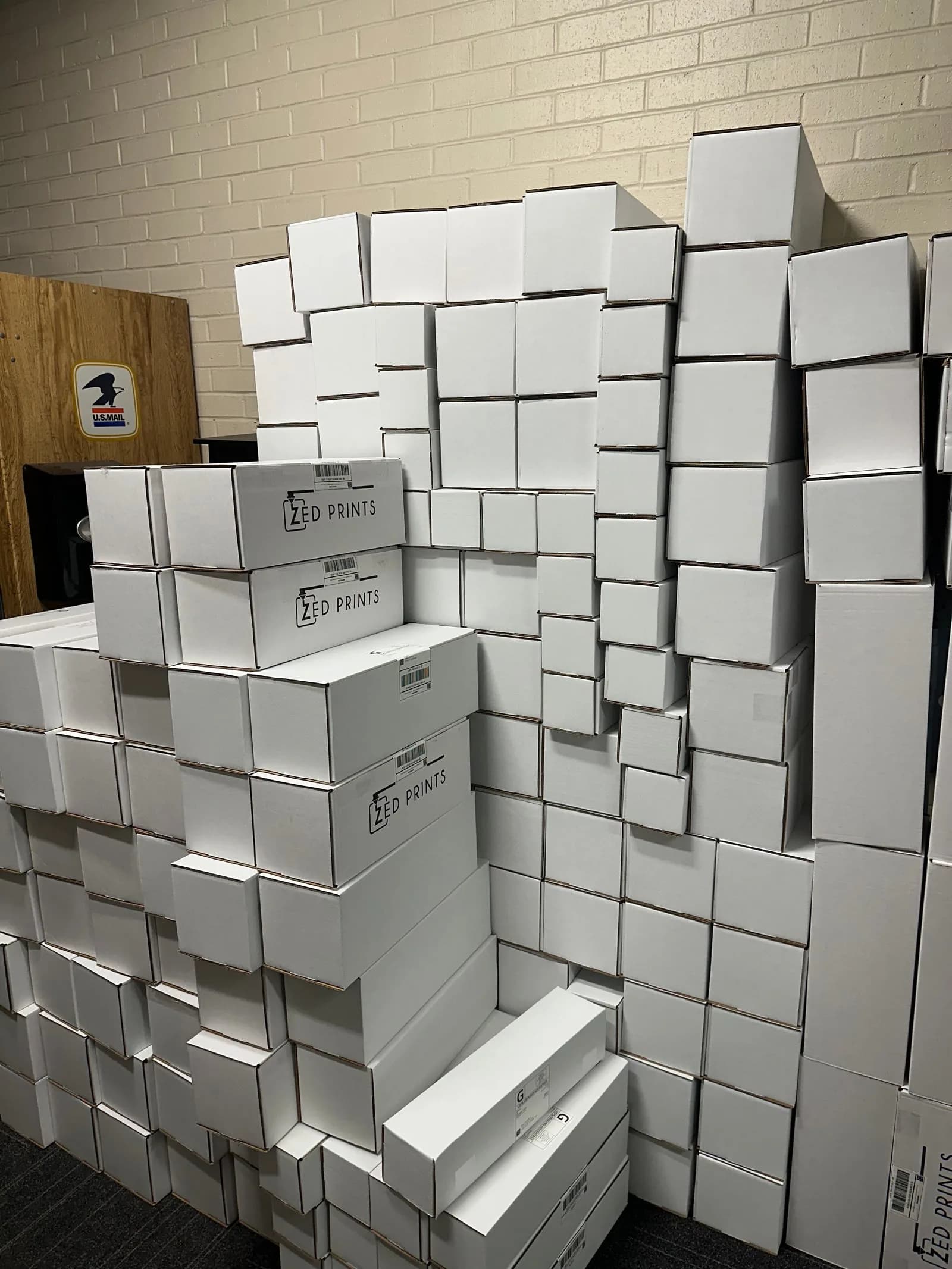 Stacked ZedPrints shipping boxes packed and ready to leave the studio